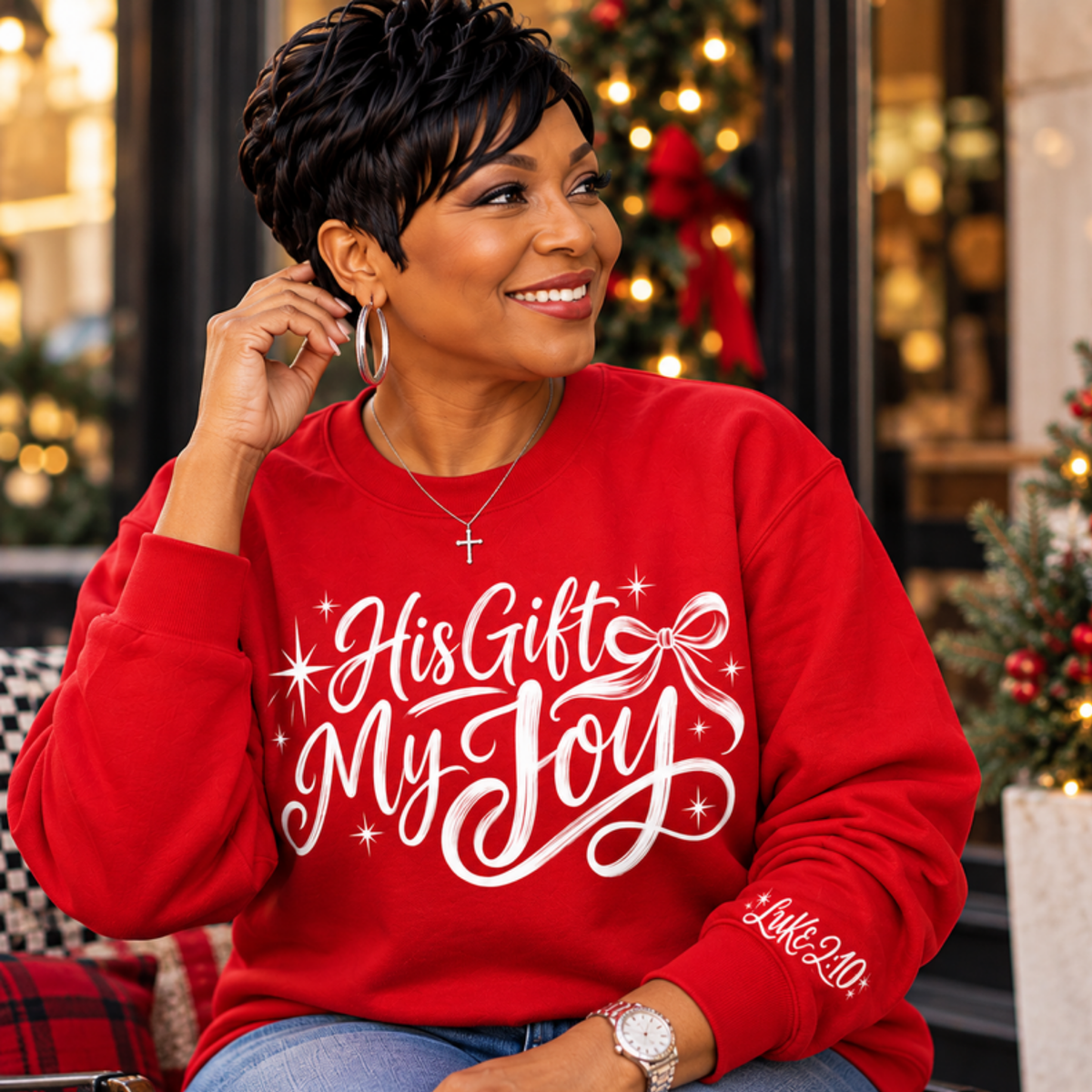 Woman wearing red His Gift My Joy crewneck sweatshirt with Christmas decor